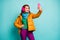 Photo of funny pretty lady hold telephone hands taking selfies wear trendy casual ear covers yellow overcoat scarf