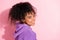 Photo of funny sweet african lady dressed purple hoodie smiling empty space isolated pink color background