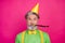 Photo of funny white haired grandpa blow noisemaker funky birthday party chilling wear paper cap green shirt yellow