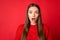 Photo of girl feel astonished open mouth scream wear season clothes isolated over vibrant red color background