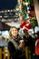 Photo of girl with glass in hands near boxes with gifts