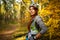 Photo of girl in helmet on bicycle in autumn forest