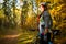 Photo of girl in helmet on bicycle in autumn forest