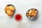 A photo of a glass of fortified wine with cookies and nuts, shot from above