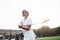 Photo of gorgeous blonde adult woman holding golf stick at the green sport field