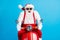 Photo of grandfather grey beard ride fast retro moped crazy open mouth wear santa claus x-mas costume suspenders goggles