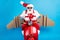 Photo of grandfather grey beard ride retro moped open mouth hold giftbox wear wings santa claus x-mas costume suspenders