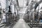 Photo of gray pipes and tanks. Chemistry and medicine production. Pharmaceutical factory. Interior of a high-tech