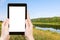 Photo of green grass on riverbank in summer day