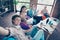 Photo of group friendly positive people sitting beanbag make selfie demonstrate v-sign prepare test indoors