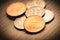 Photo of grouped dollar coins on the table.