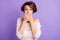 Photo of guilty pretty young woman wear knitted shirt arms close mouth lips  violet color background