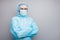 Photo of guy expert doc virology center arms crossed visit sick covid patient wear face mask hazmat blue uniform suit