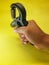 Photo of a handgrip sports equipment with a yellow background