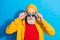 Photo of handsome cool confident hipster businessman in sunglass stare wear tracksuit isolated on blue color background