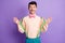 Photo of handsome impressed young man dressed yellow shirt hands arms suspenders isolated purple color background