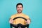 Photo of happy brunet hair man holding steering wheel his first automobile renault with good price isolated on