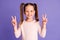 Photo of happy cheerful little child make v-sign hello pretty smile isolated on purple color background