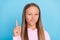 Photo of happy little young girl point finger warn good mood caution casual style isolated on blue color background