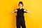 Photo of happy positive smiling good mood policewoman showing thumb-up like gesture isolated on yellow color background