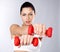 Photo of a healthy training young woman with dumbbells