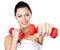 Photo of a healthy training young woman with dumbbells