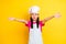 Photo of helpless troubled desperate girl plead assistance wear white apron hat isolated yellow color background