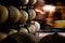 Photo of historical wine barrels in winery cellar with forklift
