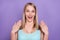 Photo of hooray blond millennial lady open mouth wear blue top isolated on violet color background