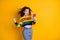 Photo of hooray pretty curly hairdo girl look telephone wear short pullover jeans isolated over shine yellow color