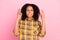 Photo of hopeful lady close eyes crossed fingers bite lip wear checkered shirt isolated pink color background