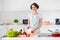 Photo of housewife attractive chef lady arms holding tomato cutting knife enjoy morning cooking tasty dinner family