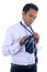 Photo image of a handsome attractive young Asian businessman dressing,making tie