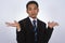 Photo image of a handsome attractive young Asian businessman with i don`t know gesture