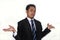 Photo image of a handsome attractive young Asian businessman with i don`t know gesture