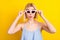 Photo of impressed blond short hair lady wear spectacles blue top isolated on yellow color background