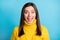 Photo of impressed cute pretty young woman dressed yellow pullover isolated blue color background