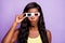 Photo of impressed dark skin person arm touch 3d glasses unexpected moment  on violet color background