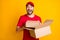 Photo of impressed delivery man wear red outfit holding brown boxes isolated yellow color background