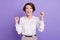 Photo of impressed funny person open mouth shout yes fists up celebrate isolated on violet color background