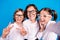 Photo of impressed funny schoolkids formalwear glasses recording video showing v-sign isolated blue color background