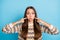 Photo of impressed funny young woman dressed ornament pullover pointing fingers cheeks pouted isolated blue color