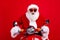 Photo of impressed grandfather wear santa costume riding on moped astonished staring rushes to give gifts isolated on