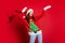 Photo of impressed shiny young woman dressed ugly pullover smiling dancing isolated red color background