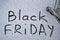 Photo of the inscription on the snow Black Friday. An inscription on the snow is about approaching black Friday