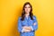 Photo of intelligent adorable gorgeous lady wear blue blouse arm crossed isolated on yellow color background