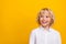 Photo of interested dreamy inspired blond schoolboy look empty space wear uniform isolated yellow color background