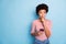 Photo of interested wondered pensive pondering girl browsing through telephone unsure about sending sms in striped shirt