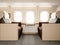 Photo interior of luxury private airplane. Empty leather chair, modern generic design laptop table. Image ready for your