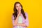 Photo of joyful dreamy minded young cheerful woman look empty space imagine plan isolated on yellow color background